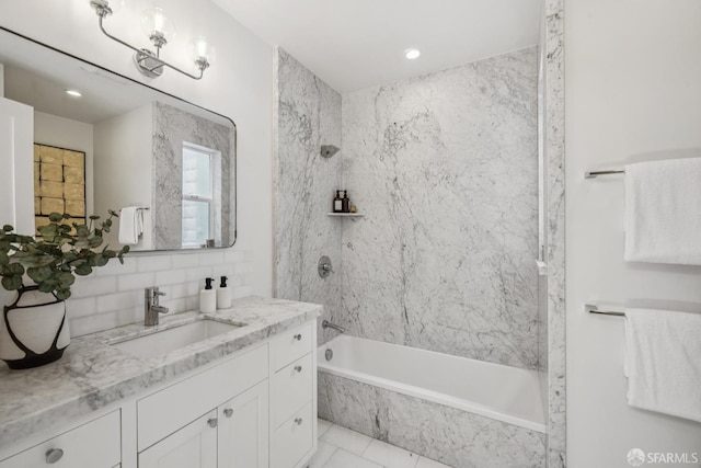 267 Bonview St, San Francisco, CA 94110 - bathroom featuring vanity, a combined bath / shower with marble appearance, decorative backsplash, and recessed lighting