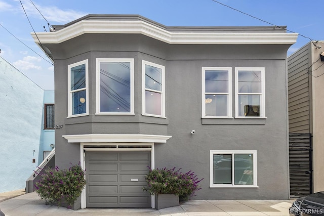 267 Bonview St, San Francisco, CA 94110 - view of home's exterior with stucco siding and a garage