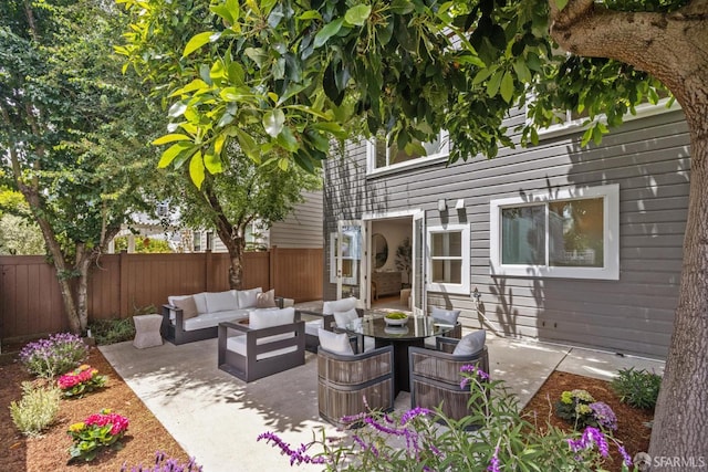 267 Bonview St, San Francisco, CA 94110 - fenced backyard featuring outdoor lounge area and a patio