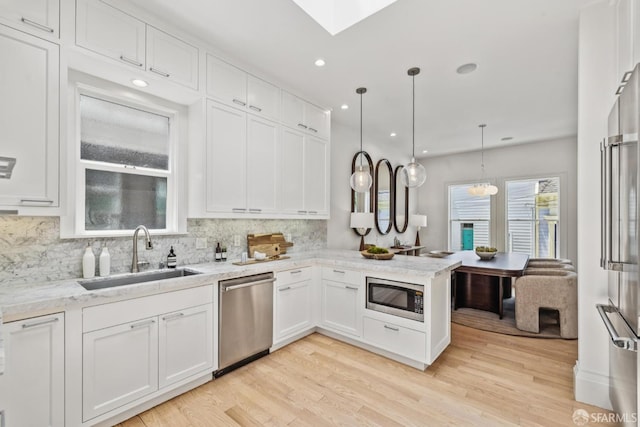 267 Bonview St, San Francisco, CA 94110 - kitchen with appliances with stainless steel finishes, white cabinetry, decorative backsplash, and recessed lighting