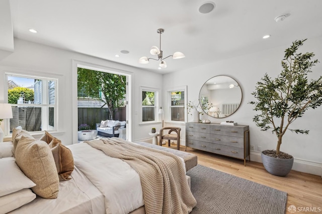 267 Bonview St, San Francisco, CA 94110 - bedroom featuring a chandelier, light wood-type flooring, access to outside, and recessed lighting