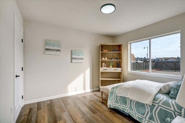 bedroom with hardwood / wood-style floors