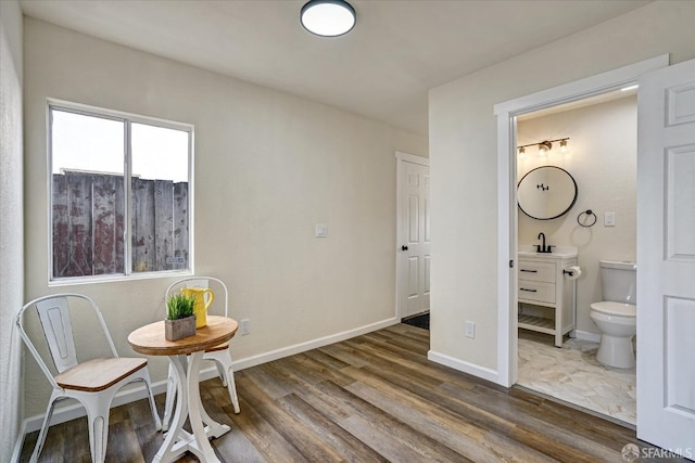 interior space featuring dark hardwood / wood-style flooring and sink