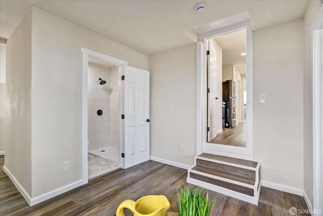 interior space featuring tiled shower and hardwood / wood-style floors