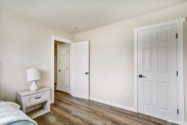 bedroom featuring dark hardwood / wood-style flooring