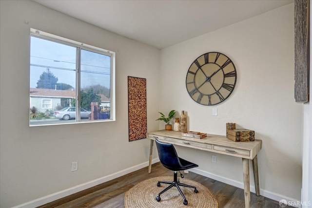 office with dark wood-type flooring