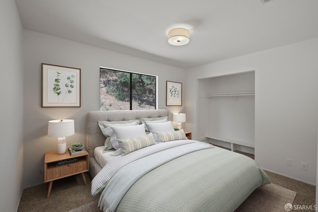 bedroom with carpet flooring and a closet