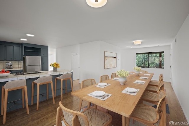 dining room with light wood-style flooring