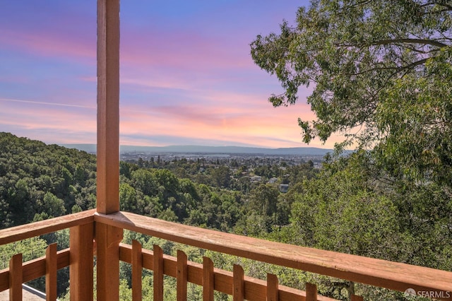 exterior space featuring a forest view