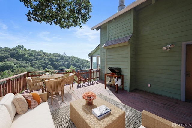 deck featuring outdoor dining area