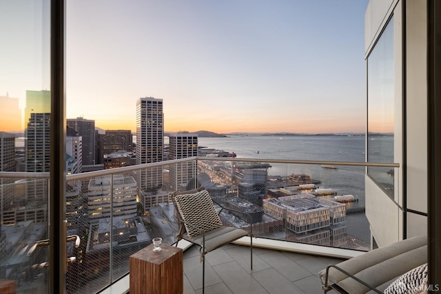 balcony at dusk with a water view