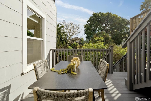 wooden deck featuring outdoor dining space