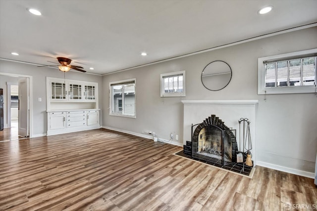 2830 Parker Ave, Oakland, CA 94605 - unfurnished living room featuring wood finished floors, a fireplace, ceiling fan, recessed lighting, and ornamental molding