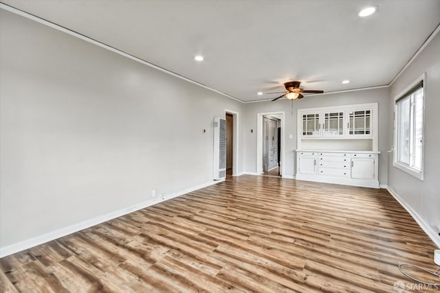 2830 Parker Ave, Oakland, CA 94605 - unfurnished living room featuring crown molding, a heating unit, recessed lighting, wood finished floors, and a ceiling fan