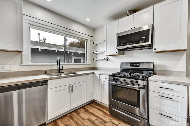 2830 Parker Ave, Oakland, CA 94605 - kitchen featuring appliances with stainless steel finishes, light countertops, white cabinetry, and recessed lighting