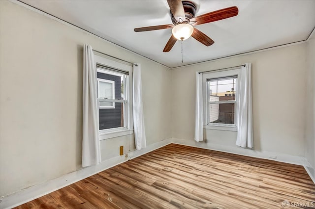2830 Parker Ave, Oakland, CA 94605 - unfurnished room featuring wood finished floors, healthy amount of natural light, and a ceiling fan