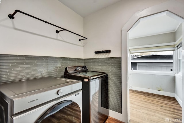 2830 Parker Ave, Oakland, CA 94605 - laundry area featuring independent washer and dryer and wood finished floors
