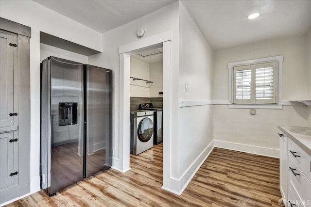 2830 Parker Ave, Oakland, CA 94605 - washroom featuring washer / clothes dryer and light wood-style flooring