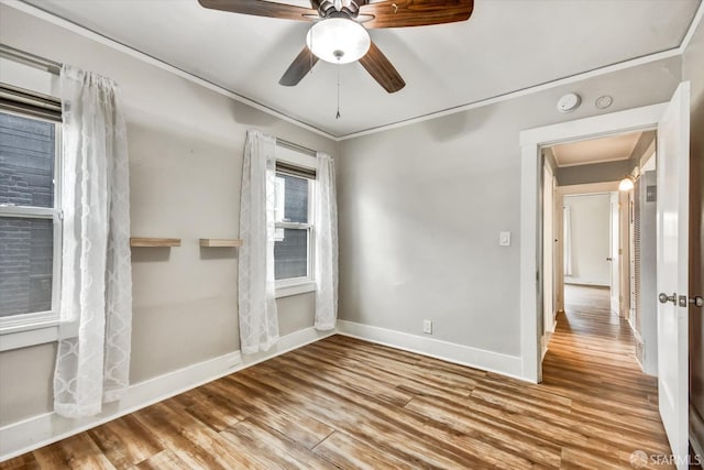 2830 Parker Ave, Oakland, CA 94605 - unfurnished room with crown molding, wood finished floors, a smoke detector, and a ceiling fan