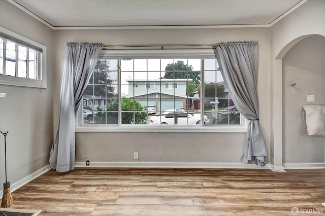 2830 Parker Ave, Oakland, CA 94605 - unfurnished room featuring wood finished floors, arched walkways, and crown molding
