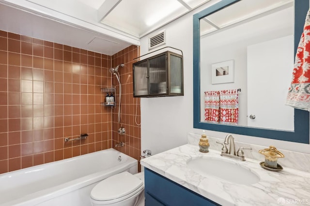 bathroom featuring shower / bathtub combination, vanity, and toilet