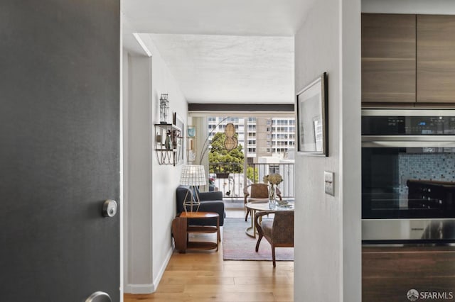 interior space featuring wood finished floors and baseboards