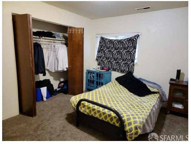 bedroom featuring a closet and carpet