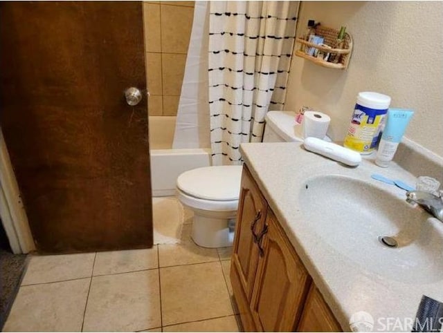 full bathroom with vanity, toilet, shower / bath combination with curtain, and tile patterned flooring