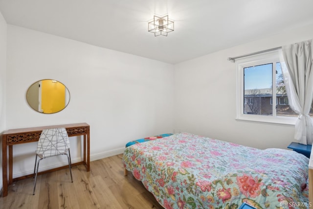 bedroom with light hardwood / wood-style floors