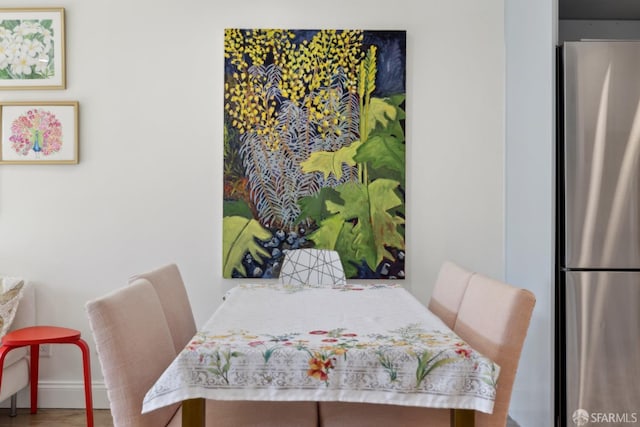 dining space featuring hardwood / wood-style flooring