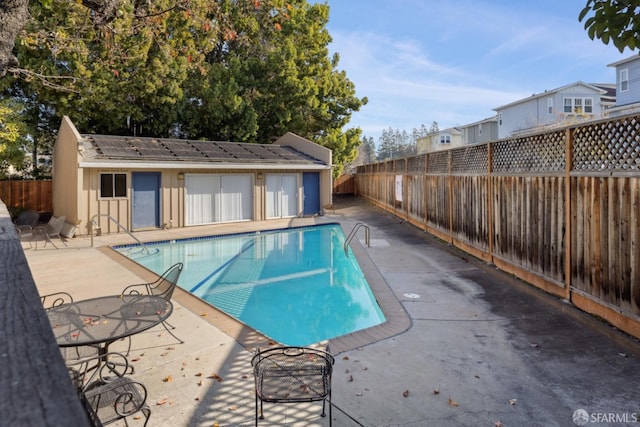 view of pool with a patio area