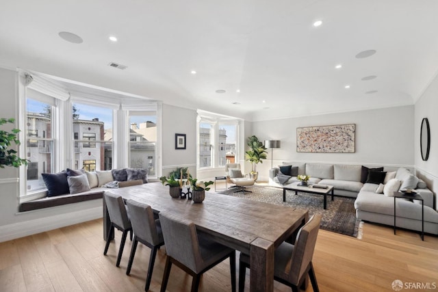 dining room with light wood-style flooring, visible vents, crown molding, and recessed lighting