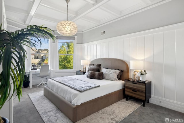 carpeted bedroom featuring coffered ceiling, visible vents, beamed ceiling, and a decorative wall