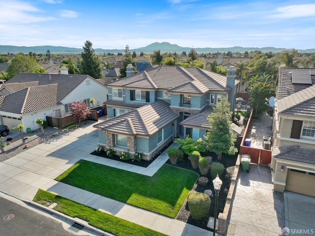 aerial view featuring a mountain view and a residential view