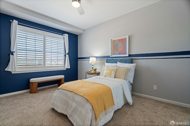 carpeted bedroom with baseboards and ceiling fan