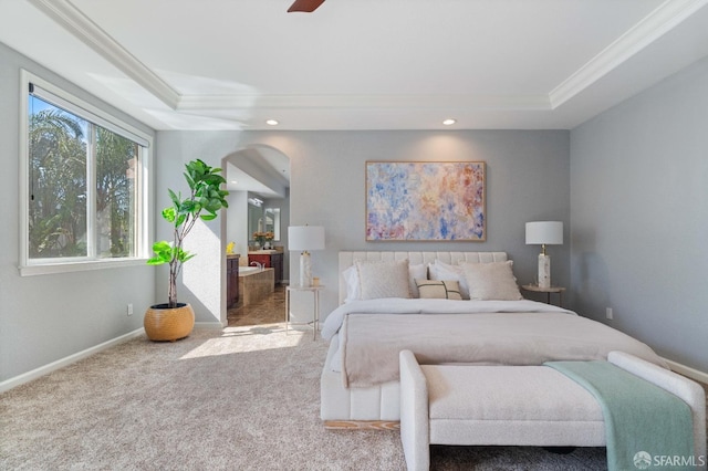 carpeted bedroom featuring recessed lighting, arched walkways, ornamental molding, and a raised ceiling