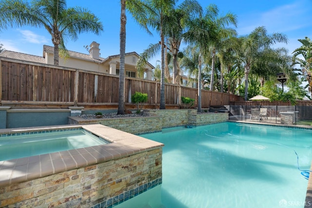 view of swimming pool featuring a fenced backyard and a fenced in pool