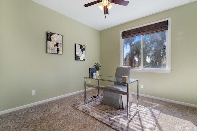 office area featuring a ceiling fan, baseboards, and carpet floors
