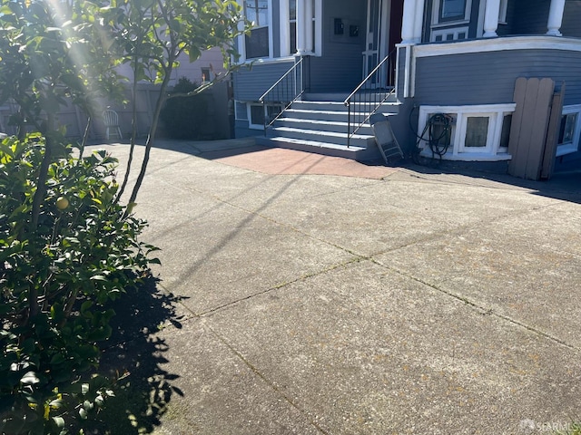 view of patio / terrace featuring fence and entry steps