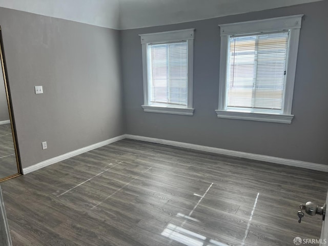 empty room featuring baseboards and a healthy amount of sunlight