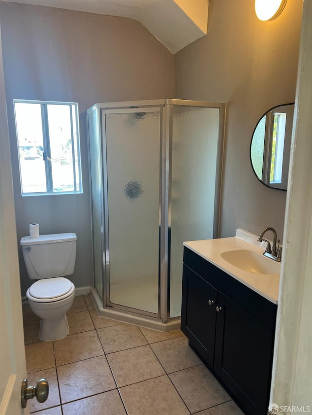 bathroom with vanity, tile patterned flooring, a shower stall, vaulted ceiling, and toilet