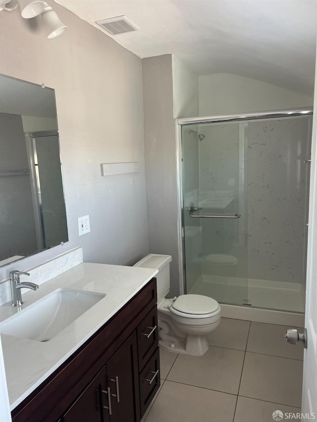 full bathroom featuring vanity, visible vents, a stall shower, tile patterned flooring, and toilet