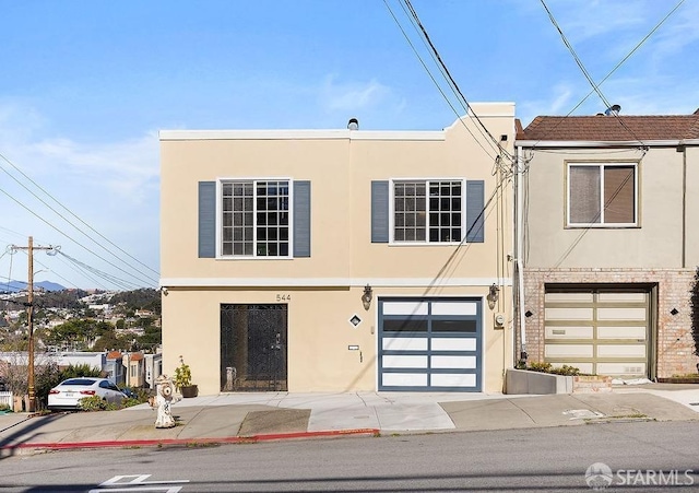 view of front of home with a garage