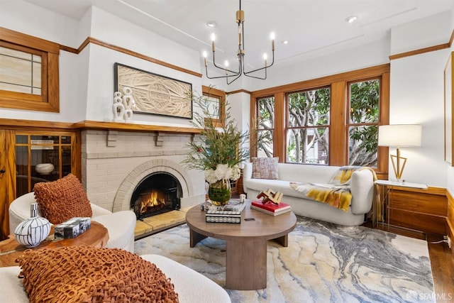 sitting room with an inviting chandelier and a fireplace