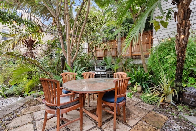 view of patio featuring a grill