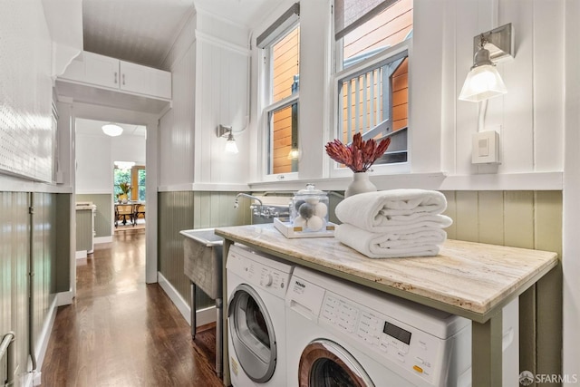 washroom featuring washing machine and dryer and dark hardwood / wood-style floors