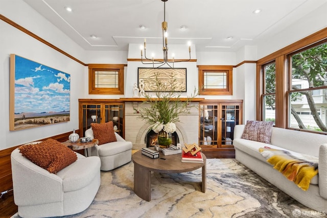 living room with a fireplace and a chandelier