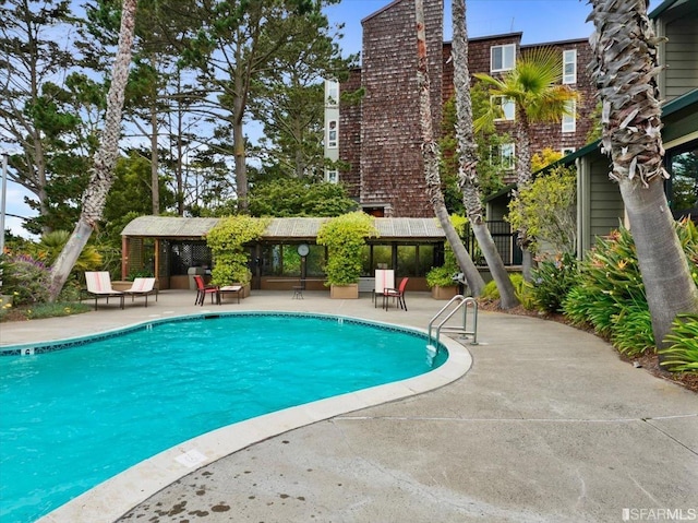 view of pool with a patio area