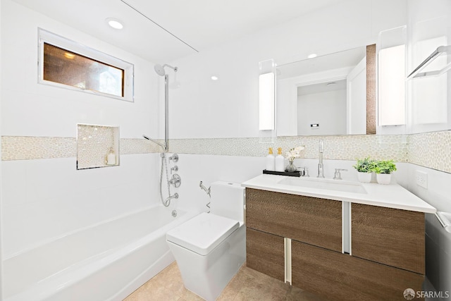 full bath with shower / bath combination, toilet, tile patterned floors, vanity, and backsplash