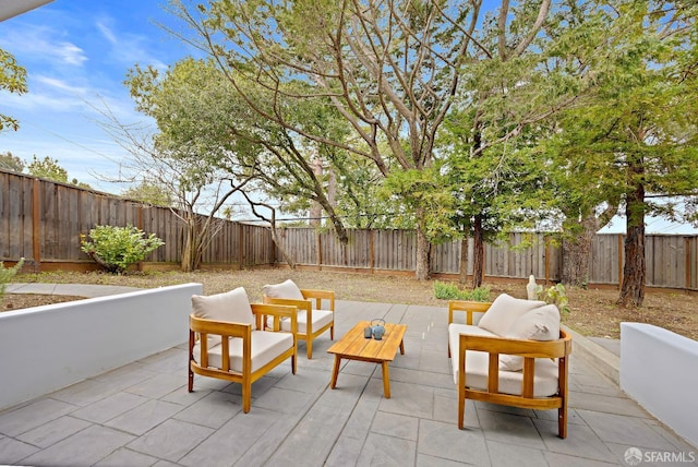 view of patio / terrace with an outdoor hangout area and a fenced backyard